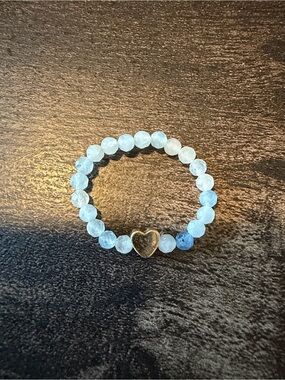 Aquamarine Stretch Ring with Gold Heart Charm..